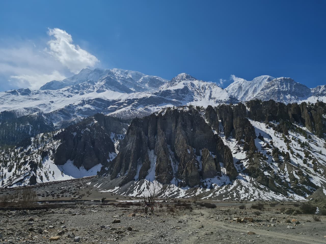 beautiful panorama of snow capped peaks in the trail to Annapurna Base Camp, showcasing  rugged Himalayan landscape and alpine terrain.